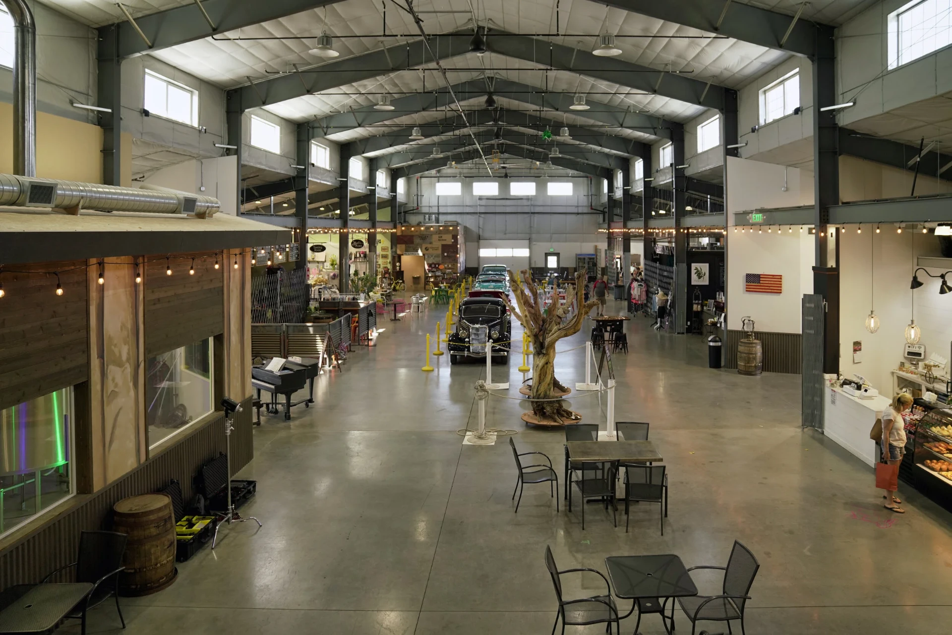 Quincy Public Market — interior of finished steel building with truss roof and vendor stalls