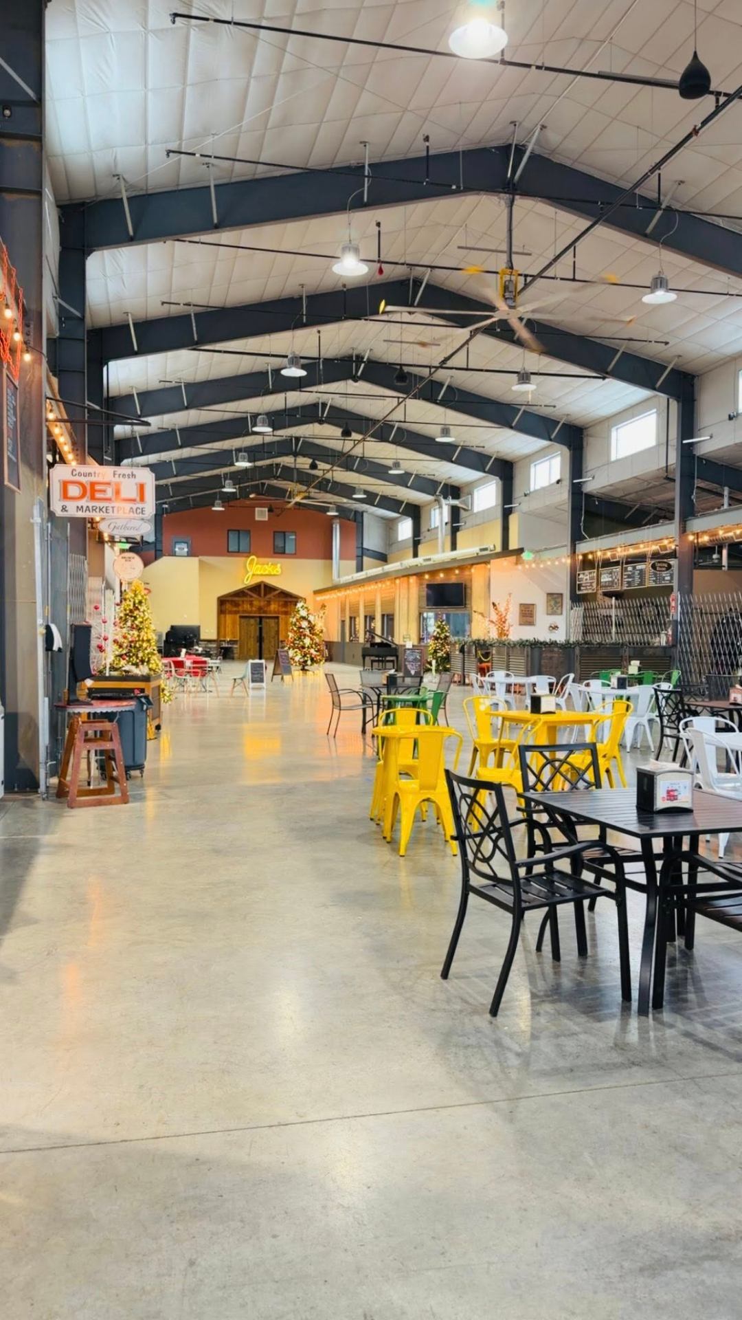 Quincy Public Market — dining area with deli, Jack's restaurant, and steel-framed open ceiling