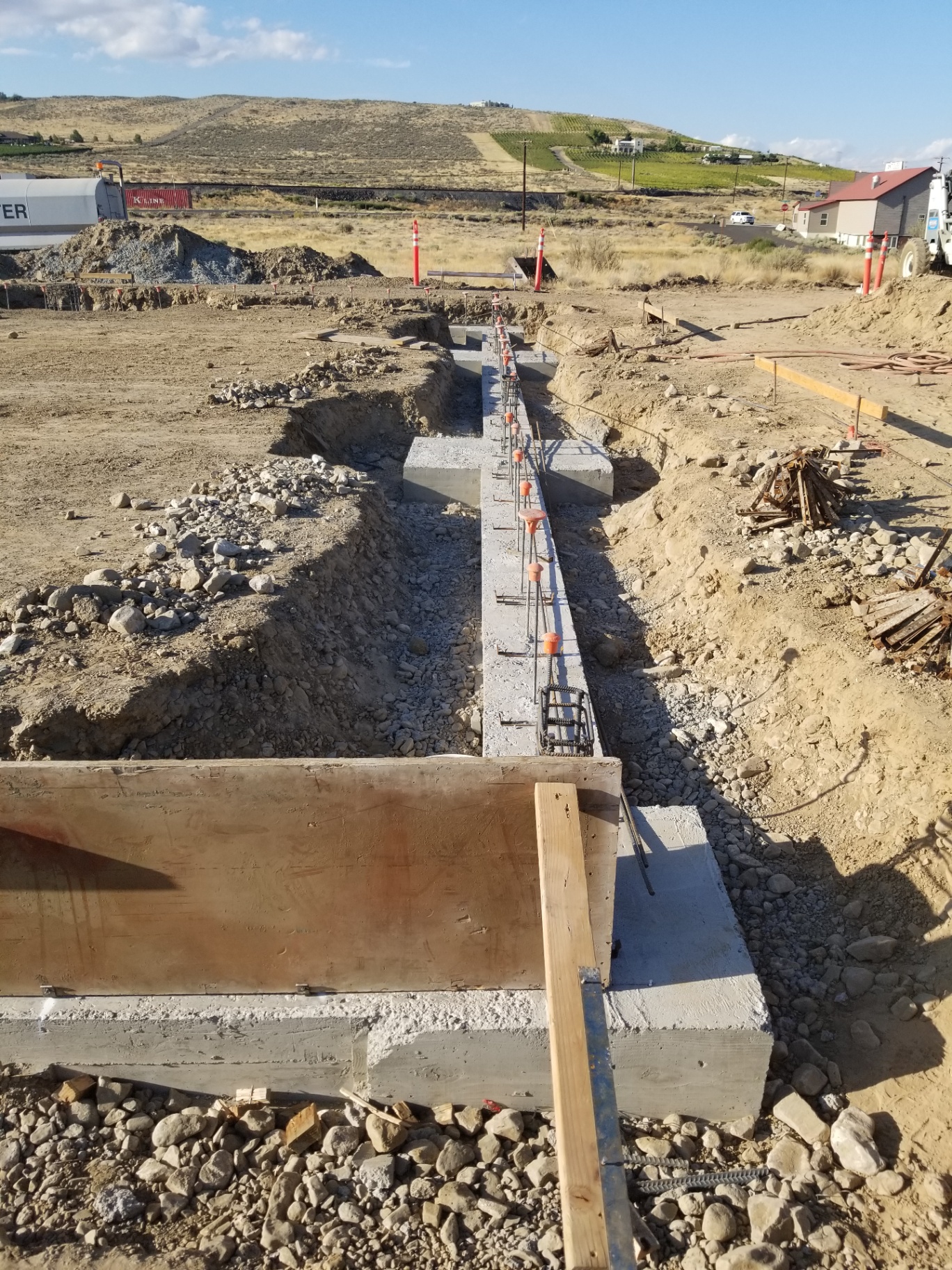 Cured concrete stem wall with rebar dowels