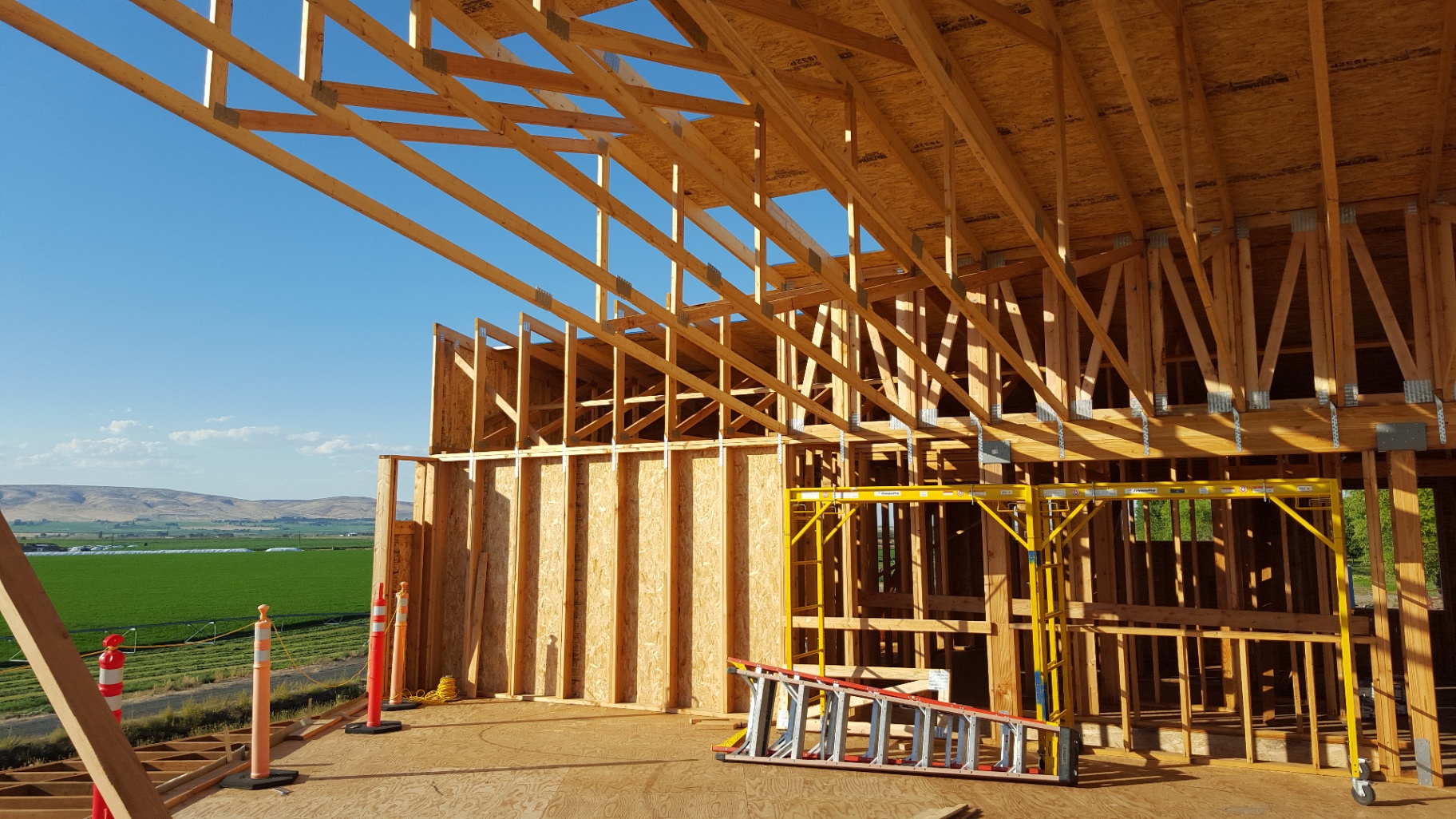 Wood-framed walls and trusses with valley views